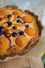 berry cake with yellow apricots and blueberries