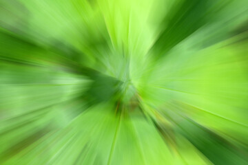 Geometric green blurred gradient background. Abstract colorful explosion effect. Centric motion pattern. Mixed texture. Color burst