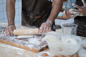 Pizza dough preparation by chef.