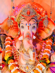 Front close up shot of Hindu God Ganesha Chaturthi idol in a sitting position