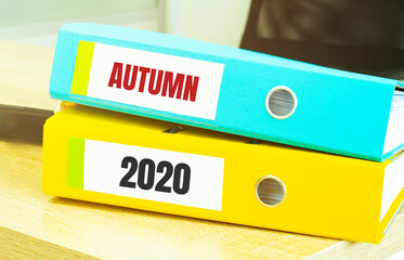 Two office folders with text AUTUMN 2020, business concept
