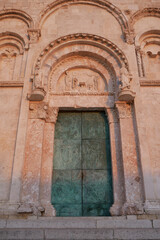 Fototapeta na wymiar The precious portal with the lunette of the Cathedral of Termoli