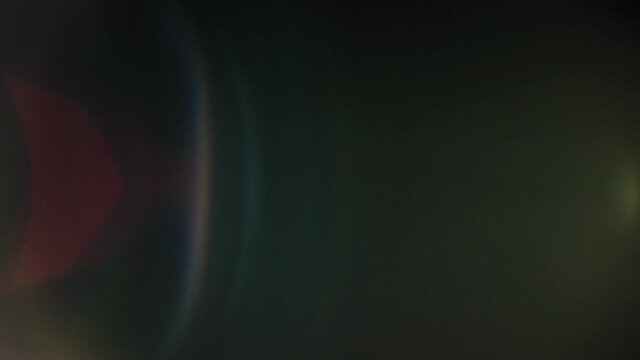 cool lens flares or leaks shot in HD 50p and on black background, nice colourful light reflections transitions.