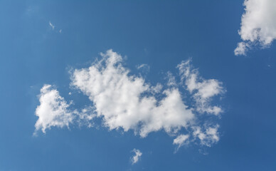 White clouds in the blue sky.