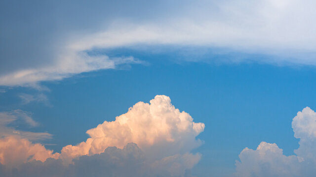 fluffy comulus in sunlight clouds in blues sky, colourful cloudy day. nature scenic background.