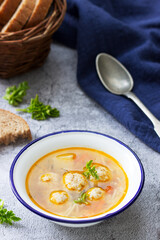 Dietary soup with meatballs, potatoes and noodles served with rye bread with bran. Children's menu.