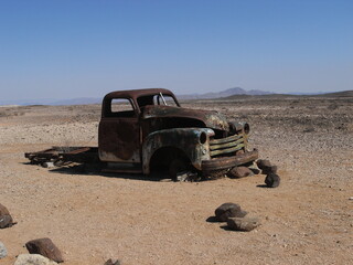 old abandoned car in the desert