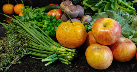 A small variety of fruits and vegetables that have just arrived from the organic fair.