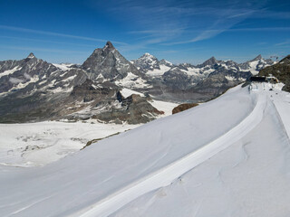 Fototapeta na wymiar Ski slopes on mount small Matterhorn over Zermatt in the Swiss alps