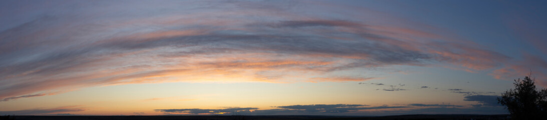Epic landscape at sunset. Tragic gloomy sky. Fantastic skies on the planet earth. Crimson twilight. Panorama.