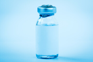 Close up of medical bottle with vaccine