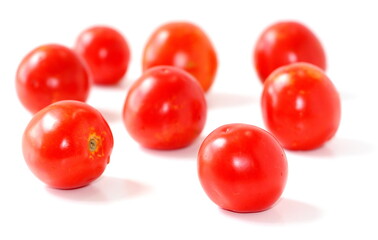 Red natural tomatoes isolated on white background.