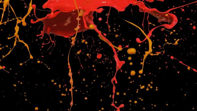 Splash of red and orange paint liquid in slow motion isolated on black (4K)