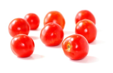 Red natural tomatoes isolated on white background.