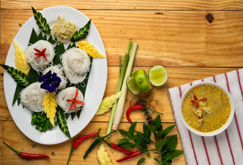 Top view Thai green curry with noodles and fresh ingredients