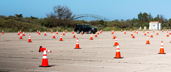 Parking lot at beach with orange construction cones blocking spots