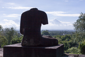 28 May 2010, Magelang, Java, Indonesia: Broken Statue Silhouette on Borobudur Temple, Indonesia