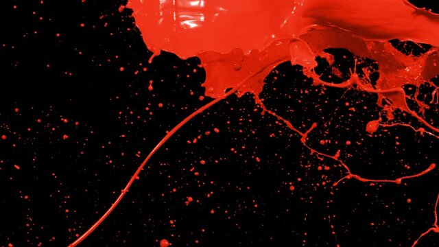 Red paint splash thrown in slow motion, liquid isolated on black (4K)