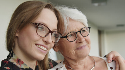 Senior and young women hugging each other. Mother and daughter bonding. High quality photo