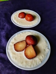 Gulab Jamum with Kheer. Indian dessert.