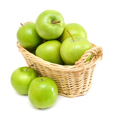 Green apples in basket on a white background