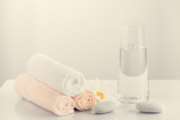 Fototapeta na wymiar towels in rolls on a light table