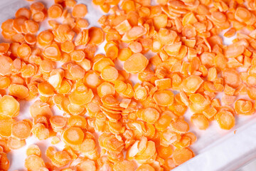 Frozen carrots on a freezer shelf