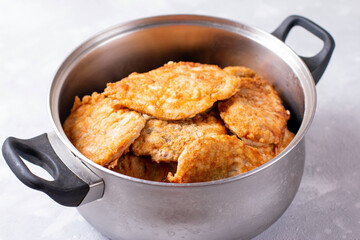 Pork chops meat in a saucepan