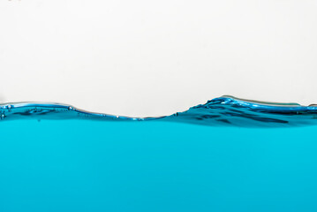 Wave of blue water on a white background.