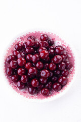 ripe cherry in close-up on white background. Copyspace