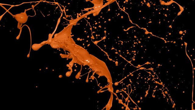 Orange paint splash thrown in slow motion, liquid isolated on black (4K)