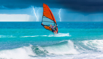 Windsurfer Surfing The Wind On Waves with strom and lightning - In Alacati, Cesme, Turkey 