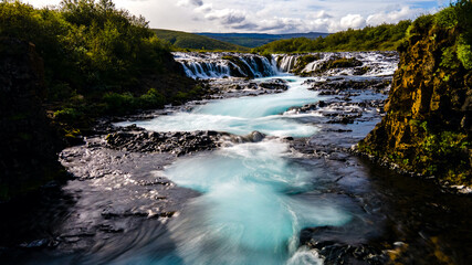 Naklejka na ściany i meble Bruarfoss Waterfall during Summer in Eastern Iceland