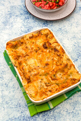 Ceramic tray with freshly baked lasagna