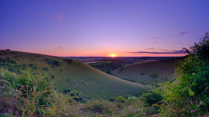 Summer sunset from Butser Hill across Ramsdean Down and Rake Bottom, South Downs National Park, UK