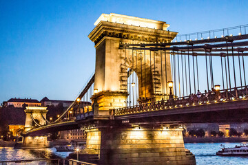 The Szechenyi Chain Bridge crossing the Danube river at dusk, Budapest, Humgary