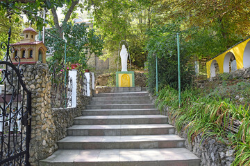 Stair leading to the statue of Our Lady with the baby Jesus. Courtyard of the Orthodox Monastery 
