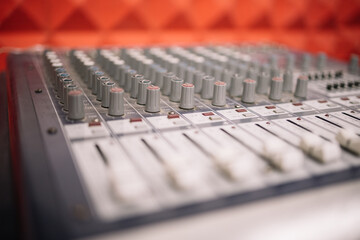 Close-up view of DJ channel mixing controller. Selective focus image of sound mixer.
