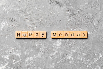 Happy monday word written on wood block. Happy monday text on cement table for your desing, concept
