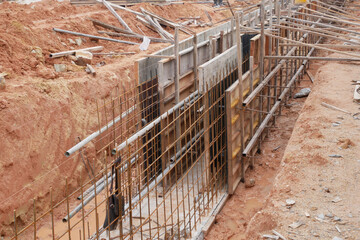 SEREMBAN, MALAYSIA -MAY 30, 2020: Concrete drain under construction at the construction site. It is built inside the earth trenches and the invert level has been determined by surveyor earlier.
