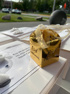 Eid Adha Mubarak for Muslim community around the world.
Happy energetic photo of Eid gifts and goody bags for Muslims in front of the Masjid.