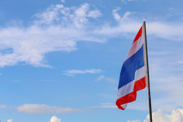 The thailand flag on wood pole have sky background
