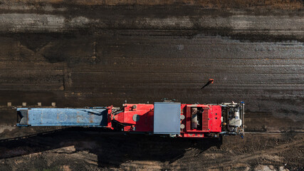Top view, Dump truck and Road milling machine working demolish surface asphalt road old for repairing. © ME Image