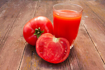 fresh tomatoes and a glass of tomato juice