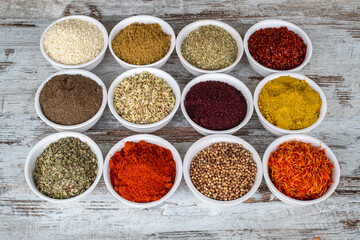 Colorful spices and herbs isolated on cooking background and design