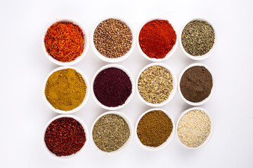 Colorful spices and herbs isolated on cooking background and design
