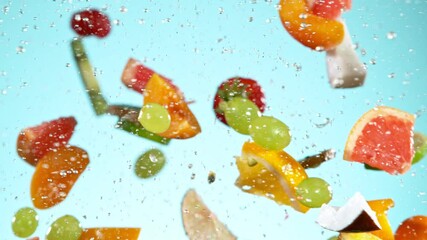 Super Slow Motion Shot of Fresh Fruits Collision with Splashing Water. Filmed on high speed cinema camera at 1000fps.