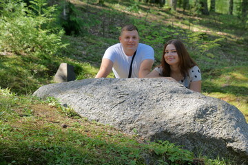 Boyfriend and girlfriend. Couple. In love. Forest Arboretum in Kudypy. Poland - Masuria - Warmia....