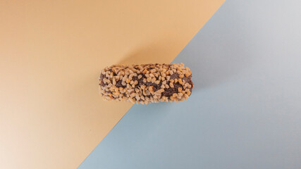 Chocolate dessert with nuts on a yellow-blue background
