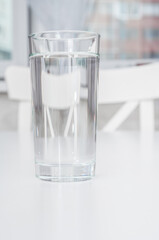 Glass with clean water on a table close up